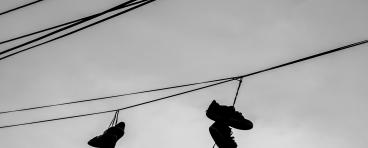 Shoes hang from a power line.