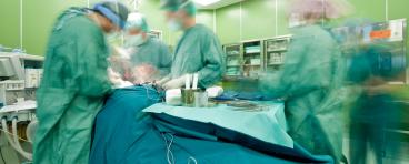 Surgeons operate on patient