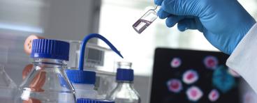 Scientist holding a vial