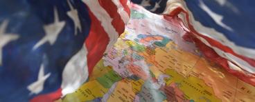 US flag drapes around Middle East regional map