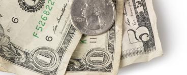 A coin and dollar bills.