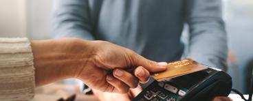 A person pays with credit card.