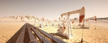 Pump jacks and pipelines move oil through the desert