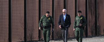 President Biden walks along US border wall