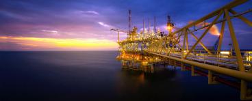 Offshore oil platform at sunrise/sunset