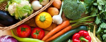 Table full of fresh vegetables and produce