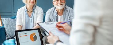 An elderly couple discusses their finances.