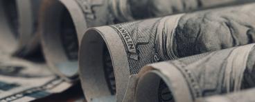 American US dollar bills rolled