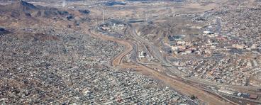 The Rio Grande River, that runs down the center of this photo, marks the US-Mexico Border