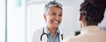Doctor consulting a patient in meeting