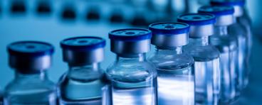 Group of Vaccine bottles. Medicine in ampoules. Glass vials for liquid samples in laboratory.