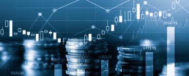 stacks of coins with graphs floating behind