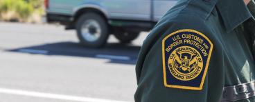 The U.S. Customs and Border Protection uniform patch of an agent standing on a road near an interior checkpoint in Southern Arizona