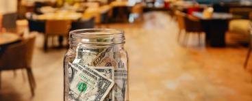 Tip jar in restaurant dining room