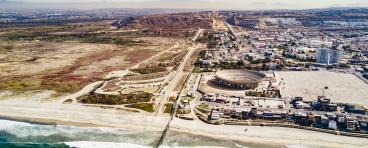 A drone shot look at the San Diego-Tijuana border from the pacific direction.