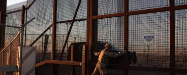 A member of the Texas Military Department opens a fence along the US-Mexico border in El Paso, Texas on January 22, 2025. On his first day back in office US President Donald Trump declared a national emergency at the southern border "to repel the disastrous invasion of our country." 