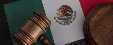 Judge gavel on flag of Mexico. Mexican legislation. 