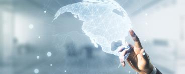 Double exposure of businessman hand working with graphic America map on blurred office background.