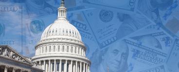 US Capitol building with dollar bills in background