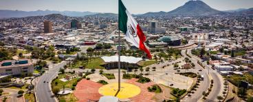 Panoramic view of Chihuahua with Mexican flag