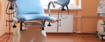 Gynecological exam chair in doctor's office