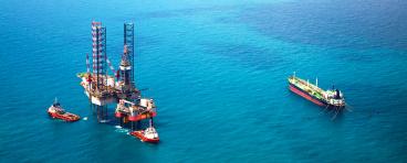 Oil rigs sitting in the ocean