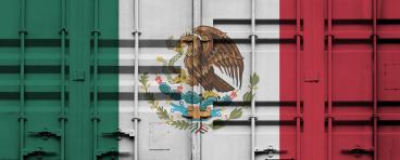 Shipping container with Mexican national flag overlay.