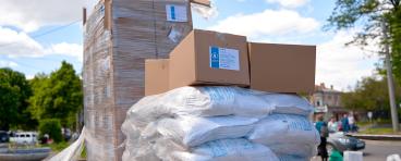 Humanitarian food aid unloaded in front of humanitarian center.