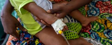 Child receiving treatment at health center at NGO in Dapaong, Togo.