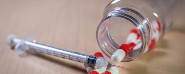 Pills and syringe