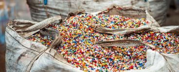 Shredded plastic garbage at waste recycling factory