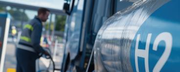 Man fueling truck with liquid hydrogen