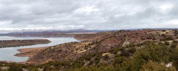 Red rocks around a reservoir