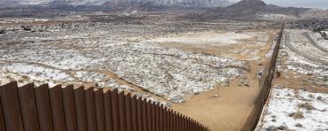 Snowy view of U.S.-Mexico border wall between Ciudad Juárez and El Paso
