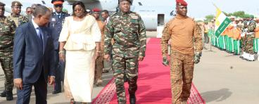military officers on red carpet at airport