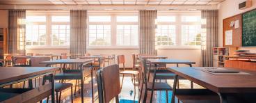 high school classroom with desks/tables and chairs