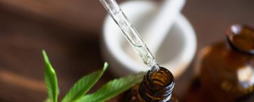Macro close up of droplet dosing a biological and ecological hemp