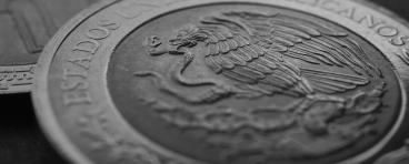 Coin of 5 Mexican pesos close-up. Peso of Mexico. Reverse of coin with coat of arms of country. 