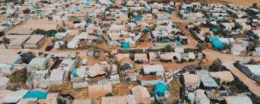Aerial view of hundreds of tents inhabited by Syrian refugees for years due to the war that destroyed their homes.