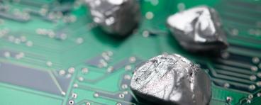 rare mineral rocks on green circuit board