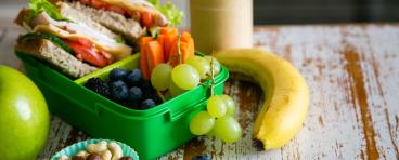 Packed school lunch on kitchen background