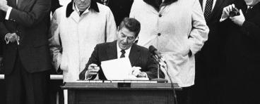 President Ronald Reagan signing bill