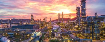 oil refinery at sunset