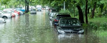 Flooded cars on the street of the city.